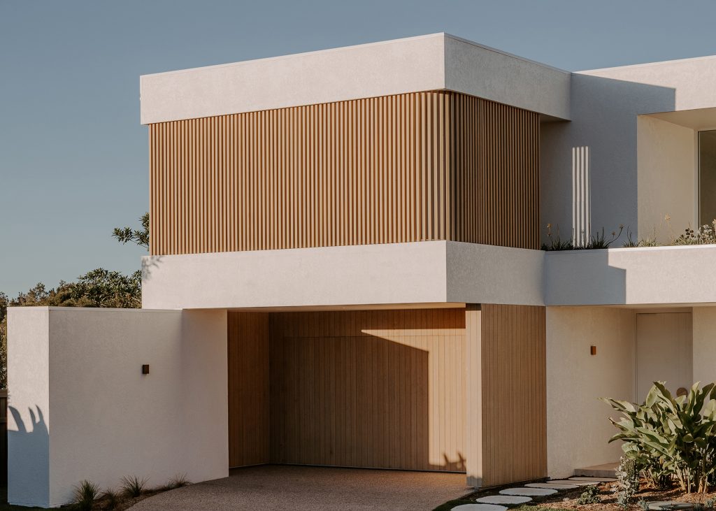 Harvest Moon Byron Bay exterior street view showing white render and timber battens