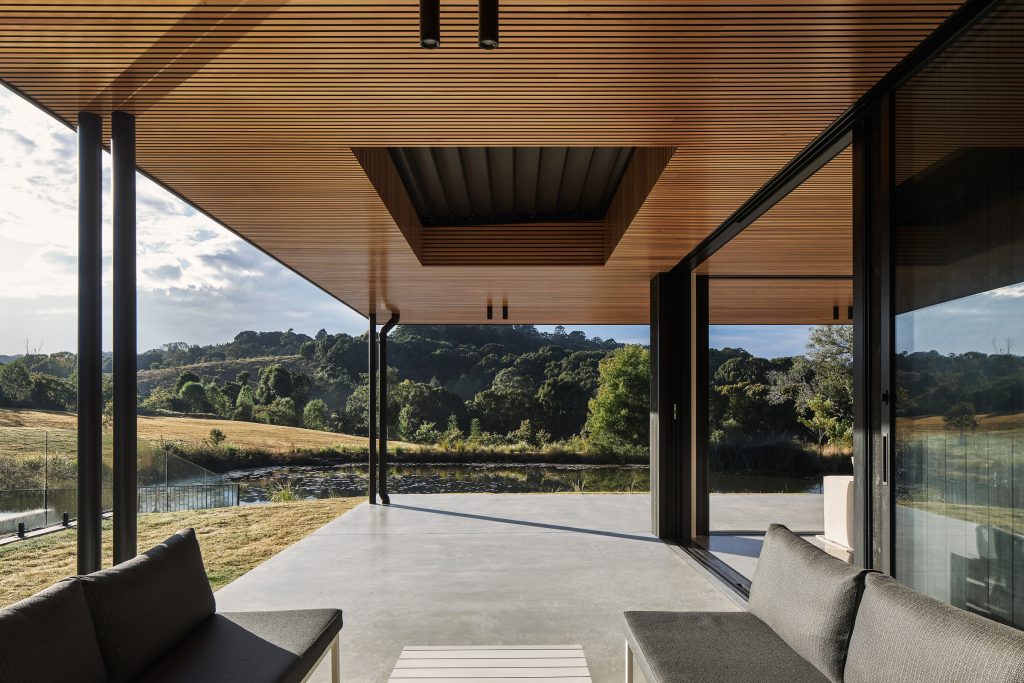 Coorabell Springs entertaining zones with concrete floors and timber batten ceilings