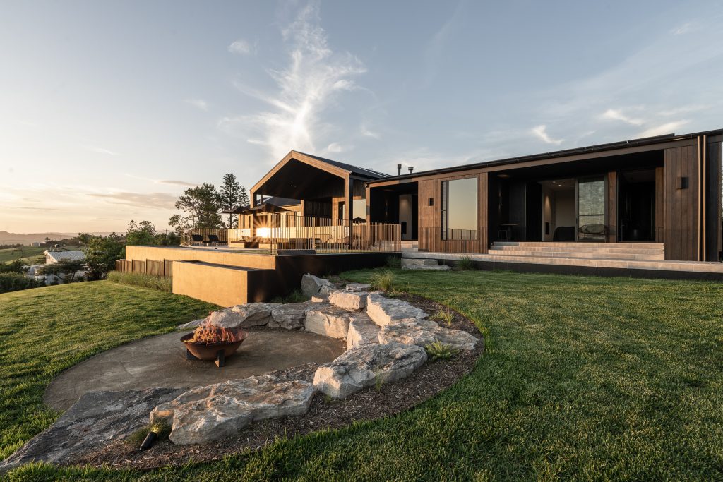 Nox Byron Bay exterior with black cladding and fire pit