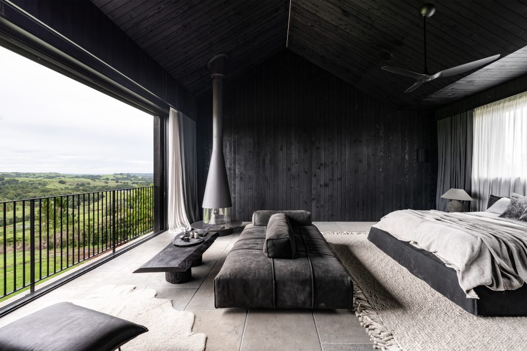 Nox Byron Bay black bedroom interiors looking out to hinterland views