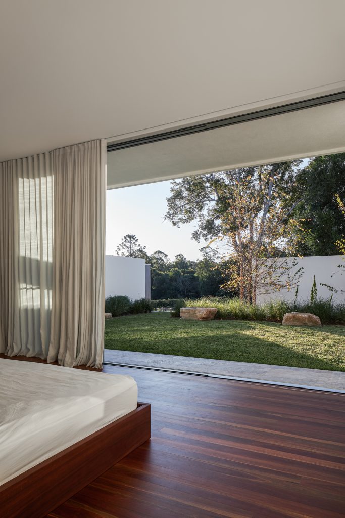 Currawong House master bedroom leading into the garden