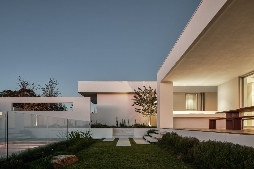 Currawong House at dusk with steps leading to the pool