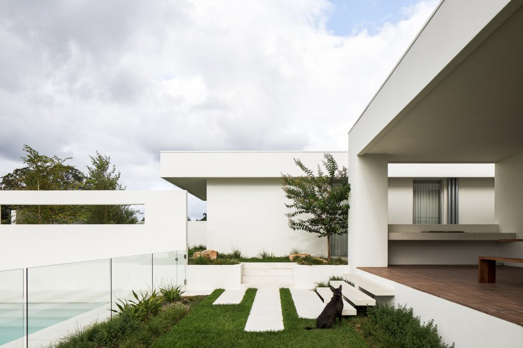 Currawong House exterior with stairs from deck to pool